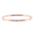 Cartier Love SM rose gold bangle bracelet with screw motifs and small diamond accents on a white background