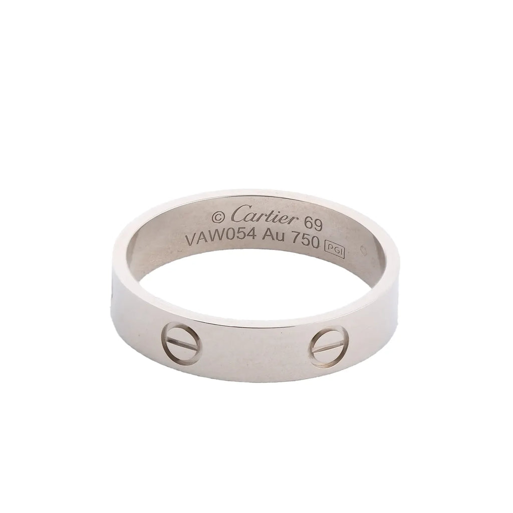 Cartier Love SM ring in 18K white gold with screw motifs and engraved Au 750 and size 69 markings on a white background.