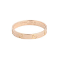 Cartier Mini Love yellow gold band ring with engraved screw motifs and “Cartier 750 61” interior hallmark