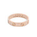 Cartier Mini Love ring in polished 18K pink gold with engraved screw motifs around the band and interior engraving.