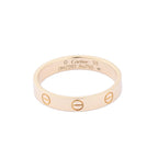 Cartier Mini Love Ring in 18K yellow gold featuring engraved screw motifs around the band, inner hallmark engraving, size 59, model OMZ097, weight 3.7g.