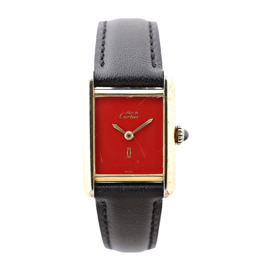 Cartier Must de Cartier Tank 3008378 watch featuring a rectangular gold-plated case, burgundy dial with gold hands, and a black leather strap with visible stitching.