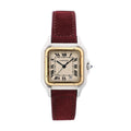 Close-up of Cartier Panthère watch with burgundy leather strap, two-tone steel and yellow-gold square case, ivory Roman numeral dial, blued hands, and date window at 6.