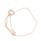 Cartier Sweet Trinity bracelet featuring interlocking 18K yellow, pink, and white gold rings on a fine yellow gold chain with adjustable loops and lobster clasp, model RV3751, weight 2.2g.