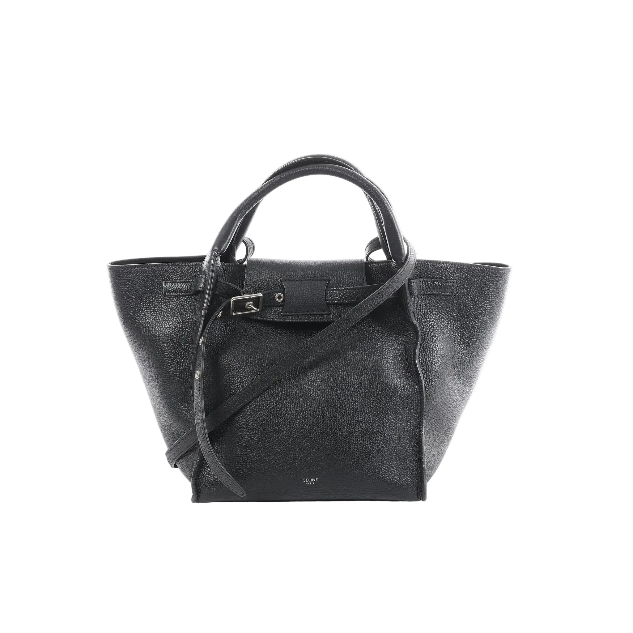 Céline Big Bag Small black grained leather tote with top handles, long shoulder strap, and front buckle strap detail, front view on white background.