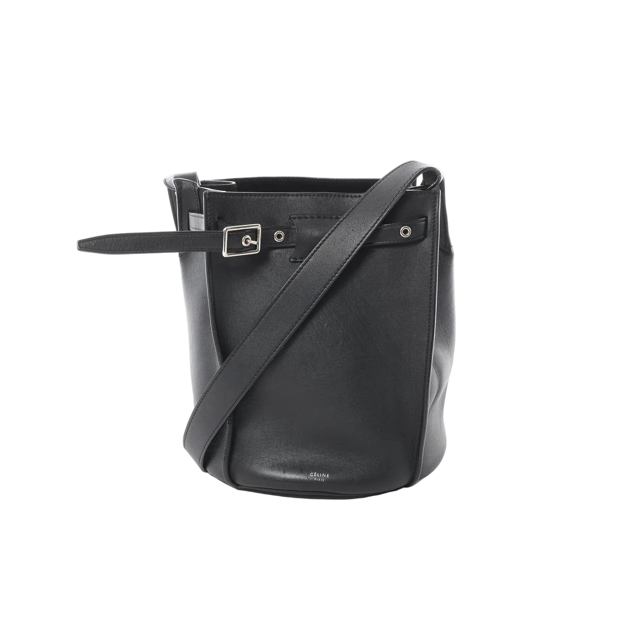 Minimalism with presence. The Céline Big Bag Bucket in black leather features a clean, sculptural shape with a belted detail and shoulder strap—an elevated everyday piece that feels quietly confident.