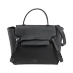 Front view of an authentic Celine Belt Bag Micro in black grained calfskin leather, featuring a top handle, front flap with signature belt detail, and detachable shoulder strap.