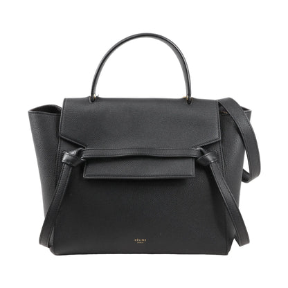 Front view of an authentic Celine Belt Bag Micro in black grained calfskin leather, featuring a top handle, front flap with signature belt detail, and detachable shoulder strap.