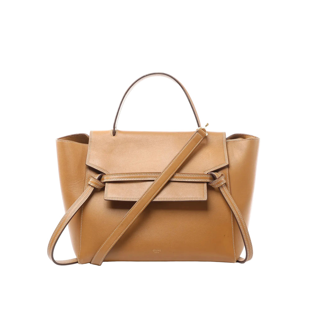 Celine Belt Bag Mini in smooth brown leather with front flap and signature belt detail, top handle, detachable shoulder strap, and contrast stitching on a light gray background.