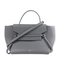 Celine Mini Belt Bag in grey leather with winged sides, belted front detail, top handle, shoulder strap and gold-tone hardware.