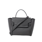 Celine Belt Bag Mini in gray grained leather with top handle, front flap and belt strap detail, and detachable shoulder strap on white background.