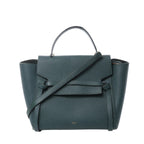 Front view of Celine Belt Bag Mini in green grained leather with top handle, long shoulder strap, flap closure with belt detail, and small gold “CELINE PARIS” logo.