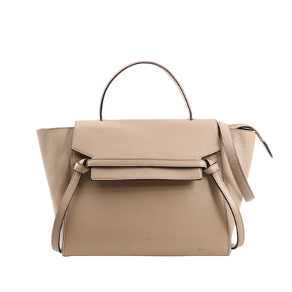 CELINE Belt Bag Mini in beige grained leather, showcasing a structured design with a top handle, signature knotted front belt detail, winged sides, and a detachable shoulder strap, photographed against a white background.