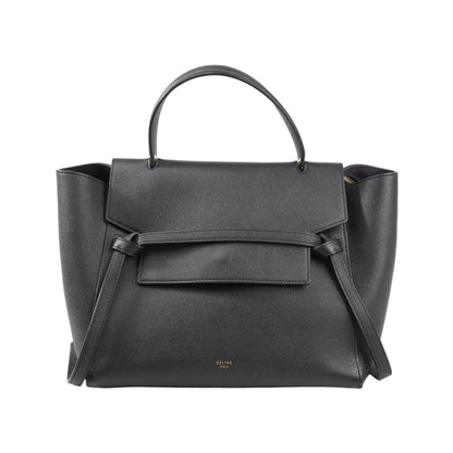 Front view of a Celine Belt Bag Mini in black grained leather featuring a top handle, flap closure with signature belt detail, and side wings, with a detachable shoulder strap for 2-way use.