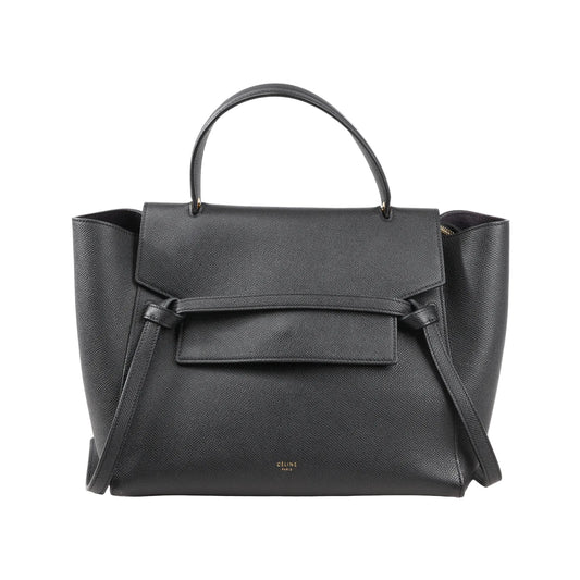 Front view of a Celine Belt Bag Mini in black grained leather featuring a top handle, flap closure with signature belt detail, and side wings, with a detachable shoulder strap for 2-way use.