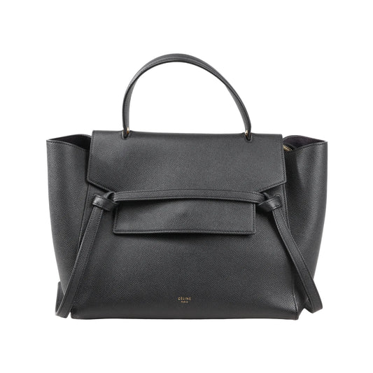 Front view of a Celine Belt Bag Mini in black grained leather featuring a top handle, flap closure with signature belt detail, and side wings, with a detachable shoulder strap for 2-way use.