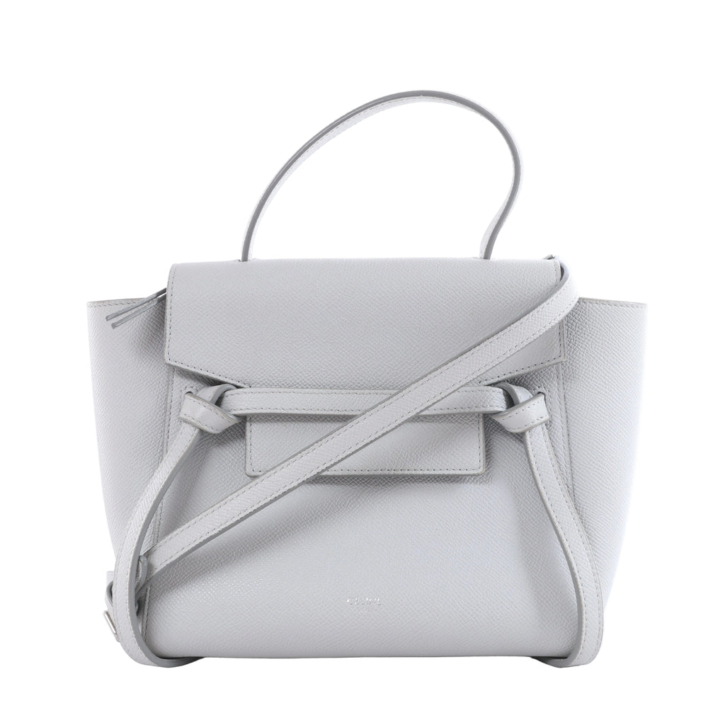 Gray Celine Belt Bag Nano leather handbag with top handle, shoulder strap, front flap and knotted belt details on a white background.