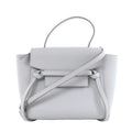 Gray Celine Belt Bag Nano leather handbag with top handle, shoulder strap, front flap and knotted belt details on a white background.