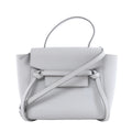 Gray Celine Belt Bag Nano leather handbag with top handle, shoulder strap, front flap and knotted belt details on a white background.