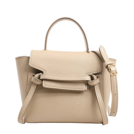 Celine Belt Bag Pico in beige grained leather featuring a structured silhouette, top handle, front flap with signature belt detail, and detachable shoulder strap with gold-tone buckle, displayed against a white background.
