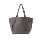 Celine Cabas Phantom medium tote in gray grained leather with long shoulder straps and side tie strap details, front view on white background