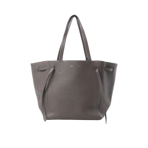 Celine Cabas Phantom medium tote in gray grained leather with long shoulder straps and side tie strap details, front view on white background