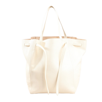 Celine Cabas Phantom medium shoulder bag in white leather with extended side ties and dual handles.