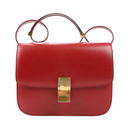 CELINE Classic Box Medium shoulder bag in smooth red calfskin leather with structured flap design, adjustable strap, and gold-tone push-lock closure.