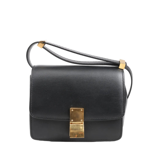 Celine Classic Box Small shoulder bag in smooth black leather featuring a structured silhouette, gold-tone push-lock closure, and adjustable leather strap.