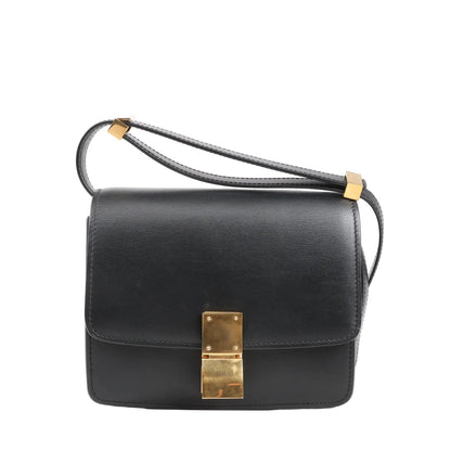 Celine Classic Box Small shoulder bag in smooth black leather featuring a structured silhouette, gold-tone push-lock closure, and adjustable leather strap.