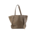 Celine Cabas Phantom Small taupe grained leather tote with long shoulder straps and side tie details on a white background