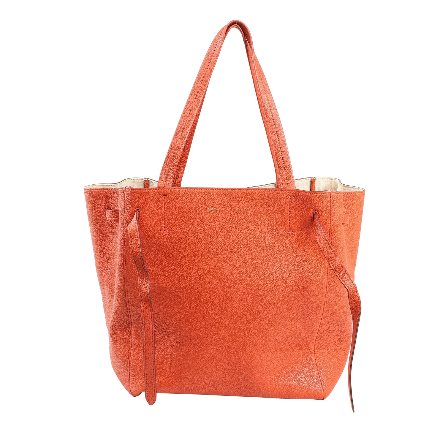 Celine Cabas Phantom Small Shoulder Bag in bright orange grained leather with long top handles, side leather ties, and minimalist open-top design.