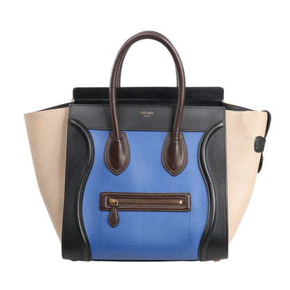 Celine Luggage Mini Handbag in multicolor leather featuring beige side panels, a blue front panel, black trim, brown top handles, and a front zip pocket with gold-tone hardware.