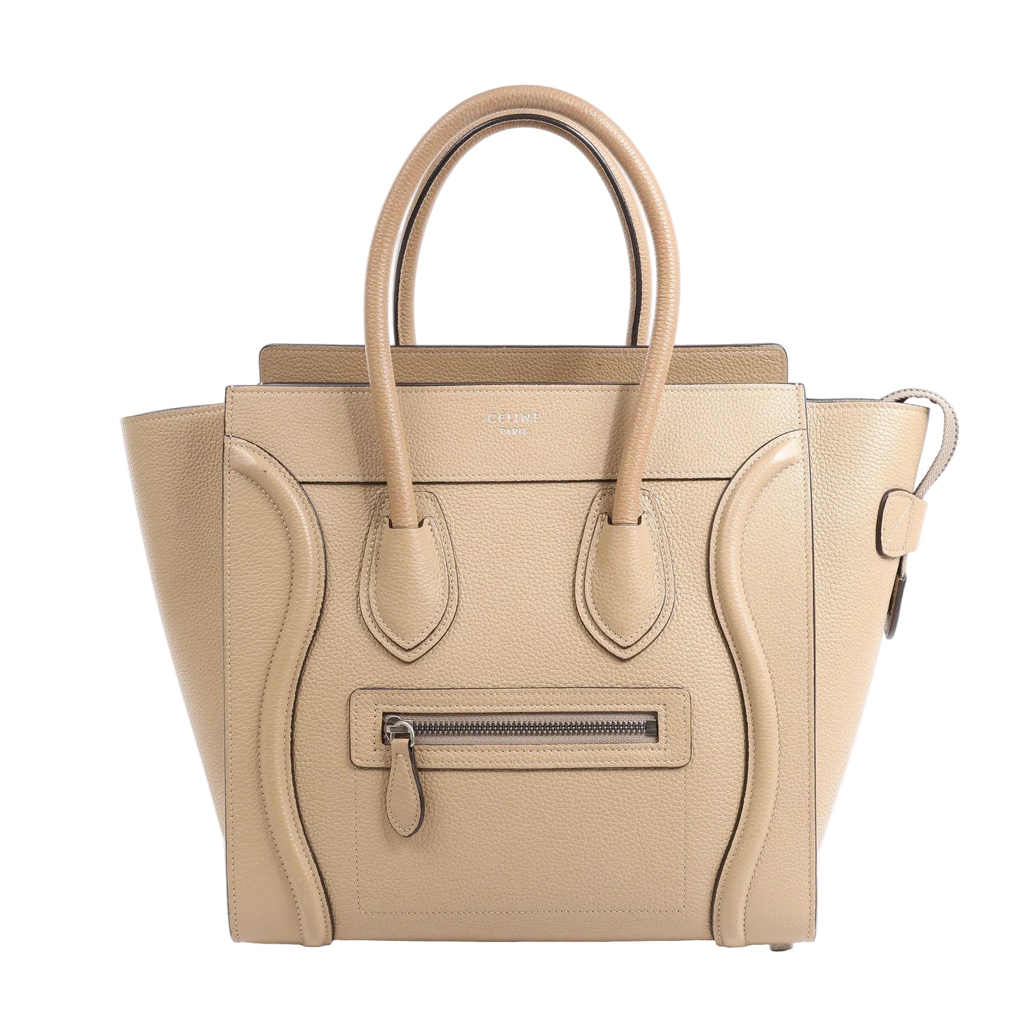 Front view of the CELINE Luggage Micro Leather Handbag in beige, showcasing grained leather texture, curved stitched accents, dual top handles, front zip pocket with leather pull, and structured trapeze shape, displayed against a white background.