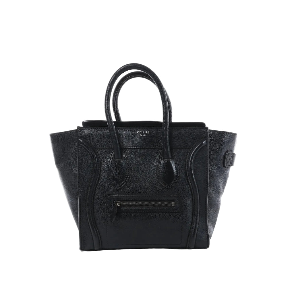 Celine Luggage Micro handbag in black grained leather with rolled top handles, winged sides and a front zip pocket.