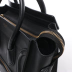 Bolso de mano Celine Luggage Micro Leather x Suede en negro y blanco