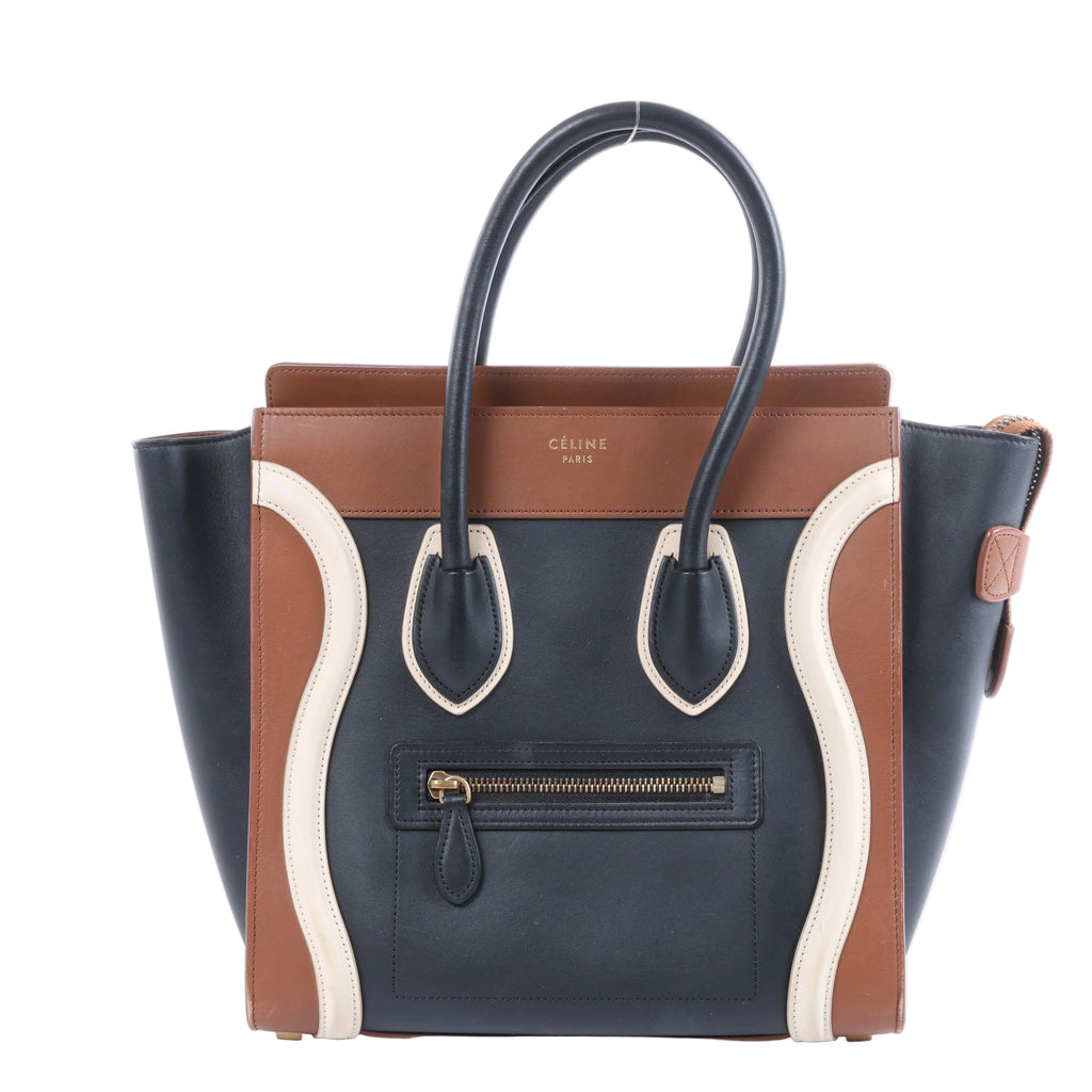 Celine Luggage Micro Shopper leather handbag in black, brown and ivory with top handles, curved front panels and front zip pocket.