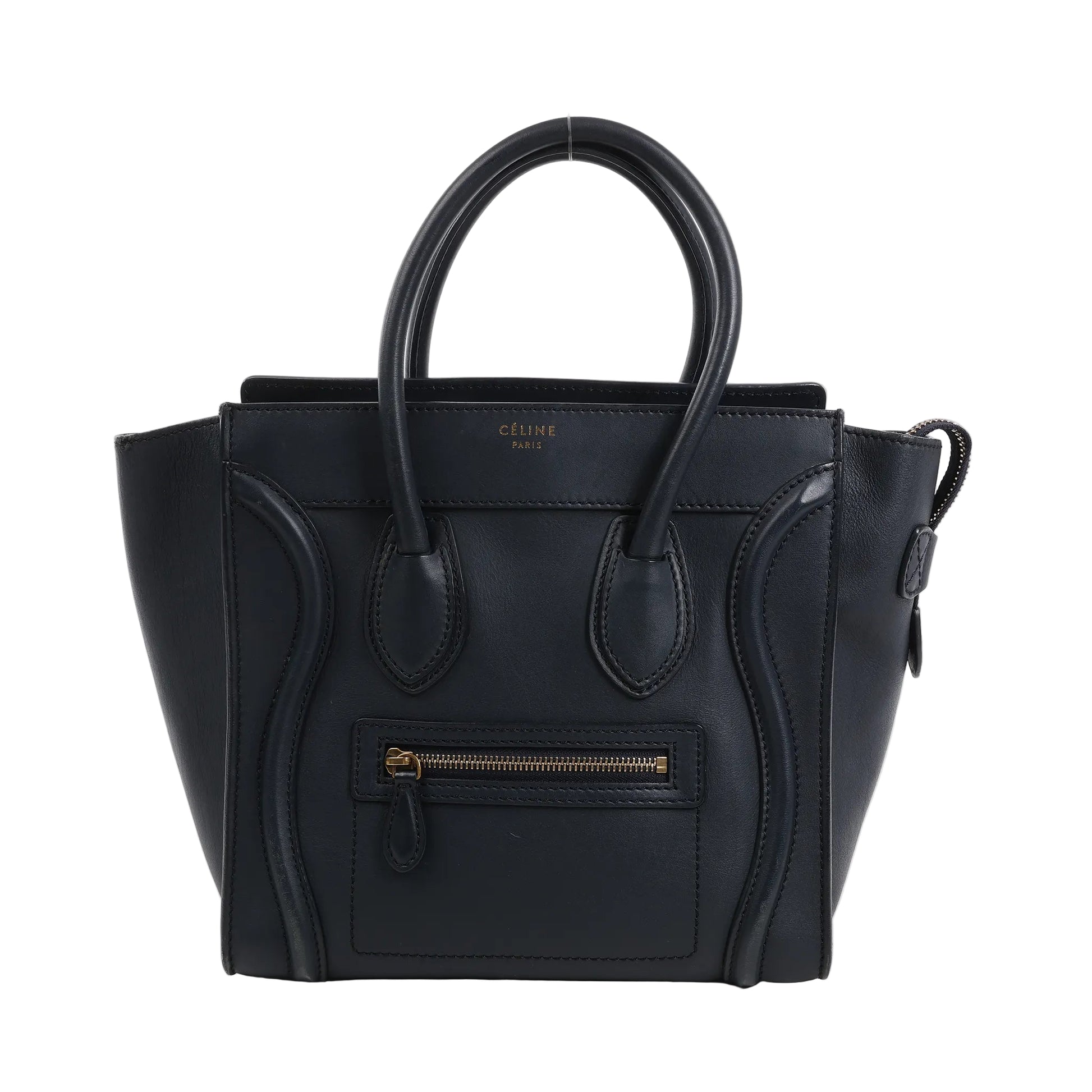Celine Luggage Micro handbag in smooth navy blue leather with dual top handles, front zip pocket, winged sides, and gold-tone zipper hardware, displayed upright against a white background.