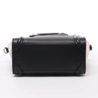 Bolso de mano Celine Luggage Micro Leather x Suede en negro y blanco