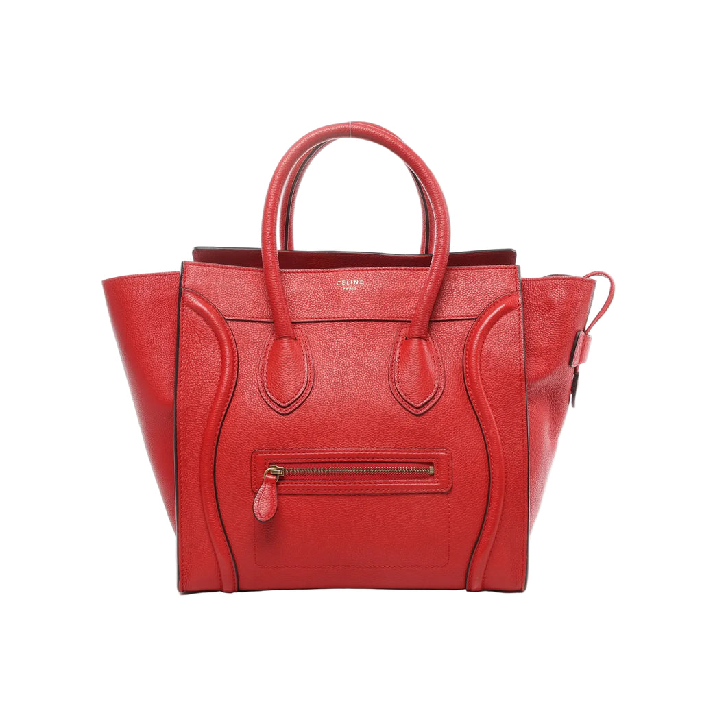 Red Celine Luggage Mini leather handbag with two top handles, signature curved front panels, front zip pocket with leather pull, and winged sides, shown on a white background.
