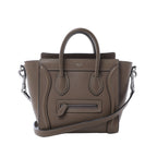 Brown Celine Luggage Nano leather handbag with pebbled texture, top handles, shoulder strap, winged sides and front zip pocket.
