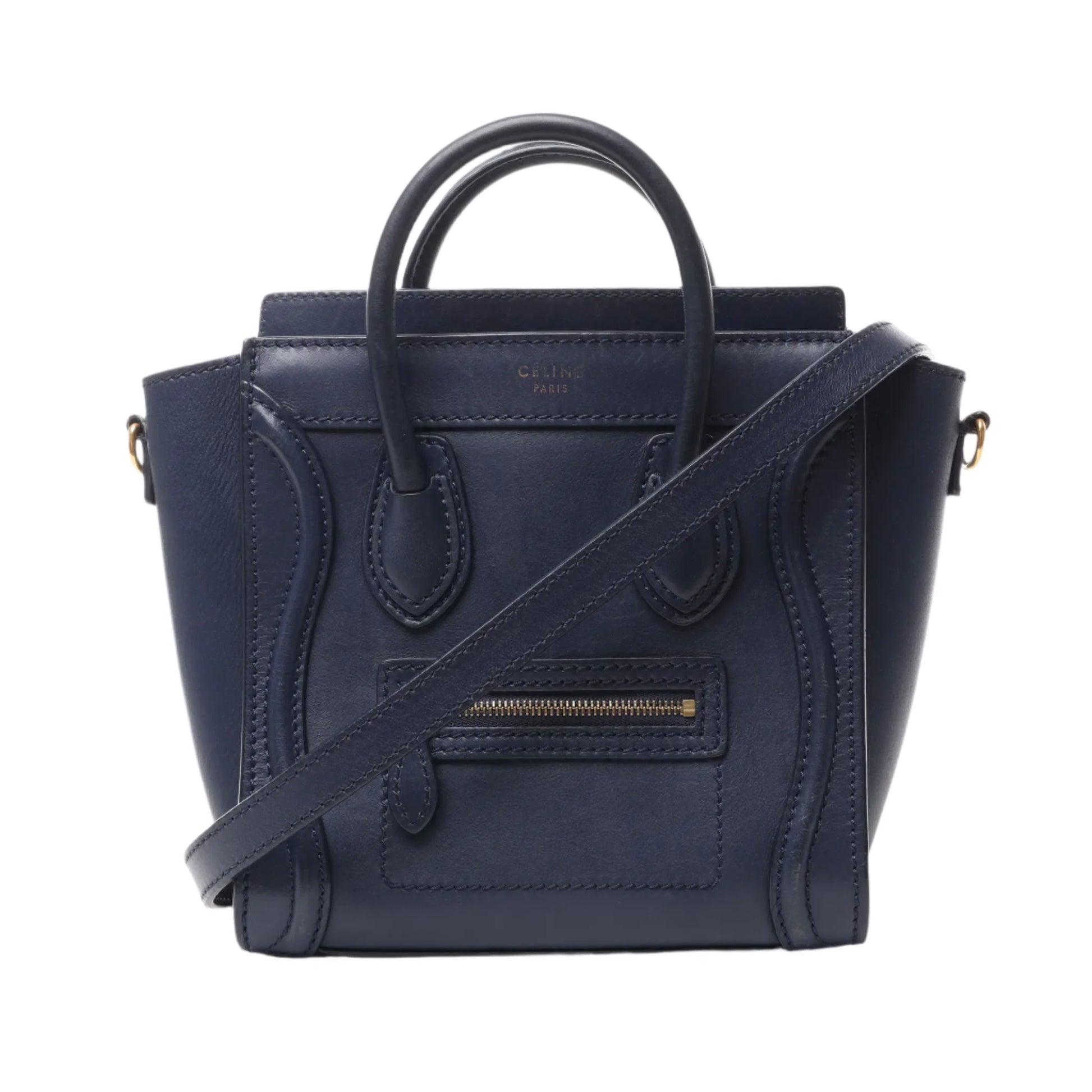 Front view of CELINE Nano Luggage 2Way Handbag in navy blue smooth leather with dual top handles, detachable crossbody strap, and signature front zip pocket, displayed against a white background.