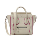 Beige Celine Luggage Nano leather handbag with purple piping, double top handles, shoulder strap, front zip pocket and silver-tone hardware.