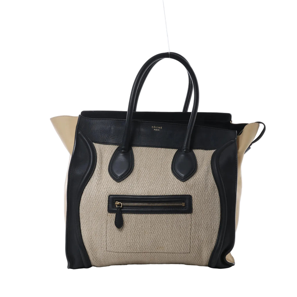 Celine Luggage Large handbag in beige canvas with black leather trim, top handles, and front zip pocket on white background.