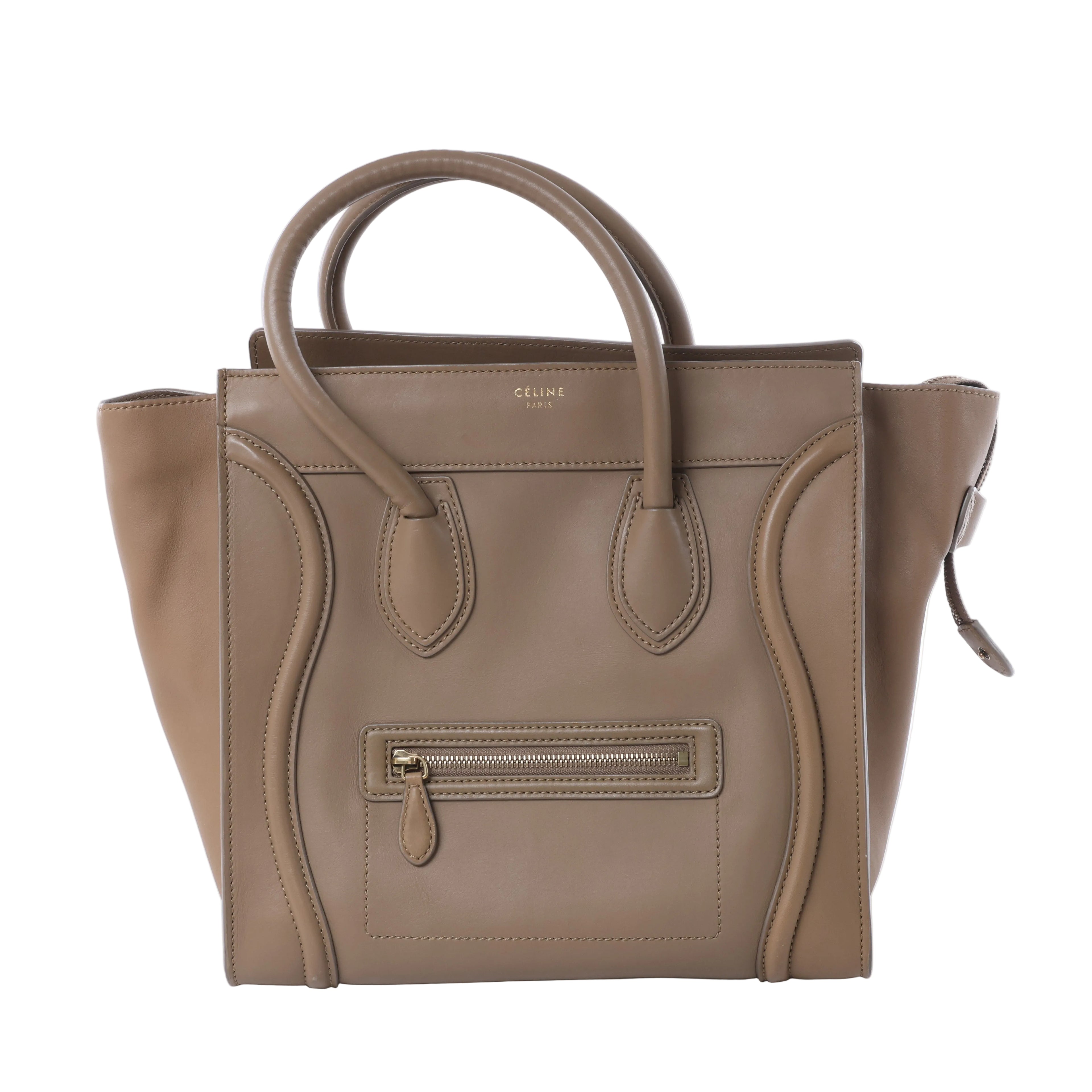 Celine Luggage Micro brown leather handbag with double top handles, winged sides, curved piping, gold-tone logo and front zip pocket.