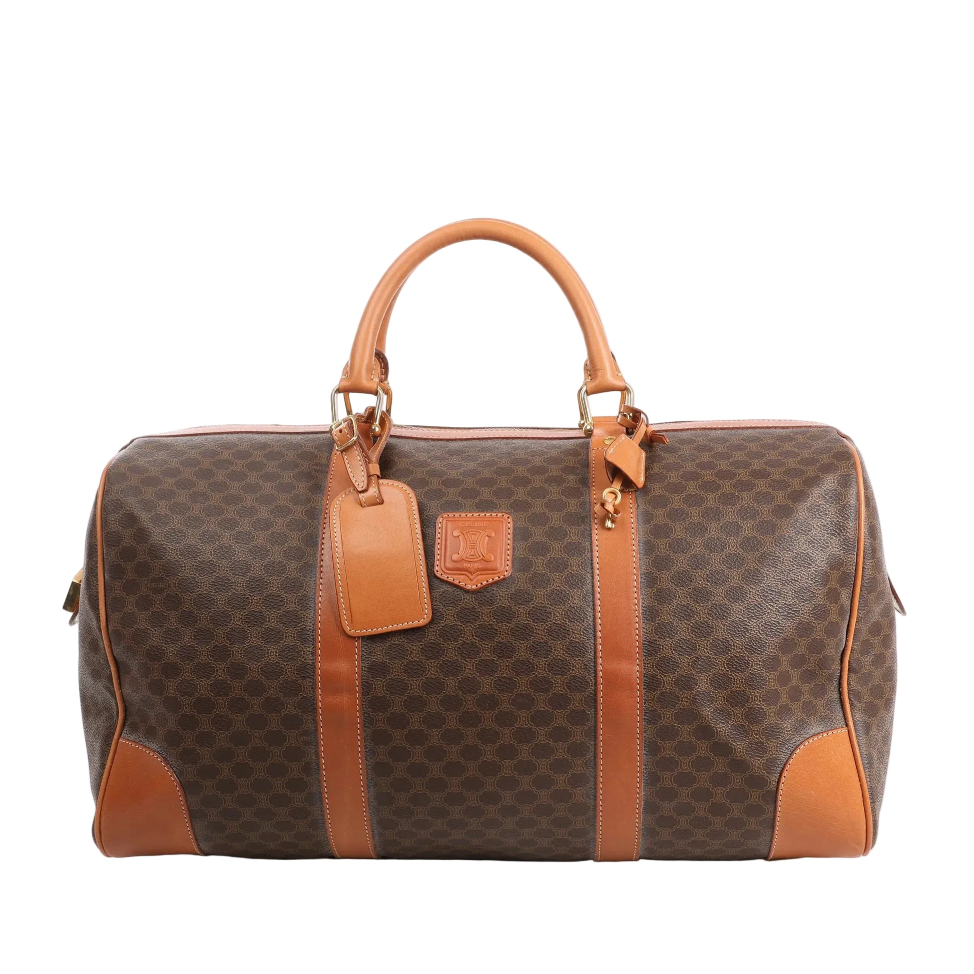 Celine Macadam Boston travel bag in brown PVC with tan leather trim, dual handles, gold-tone hardware, and structured silhouette.