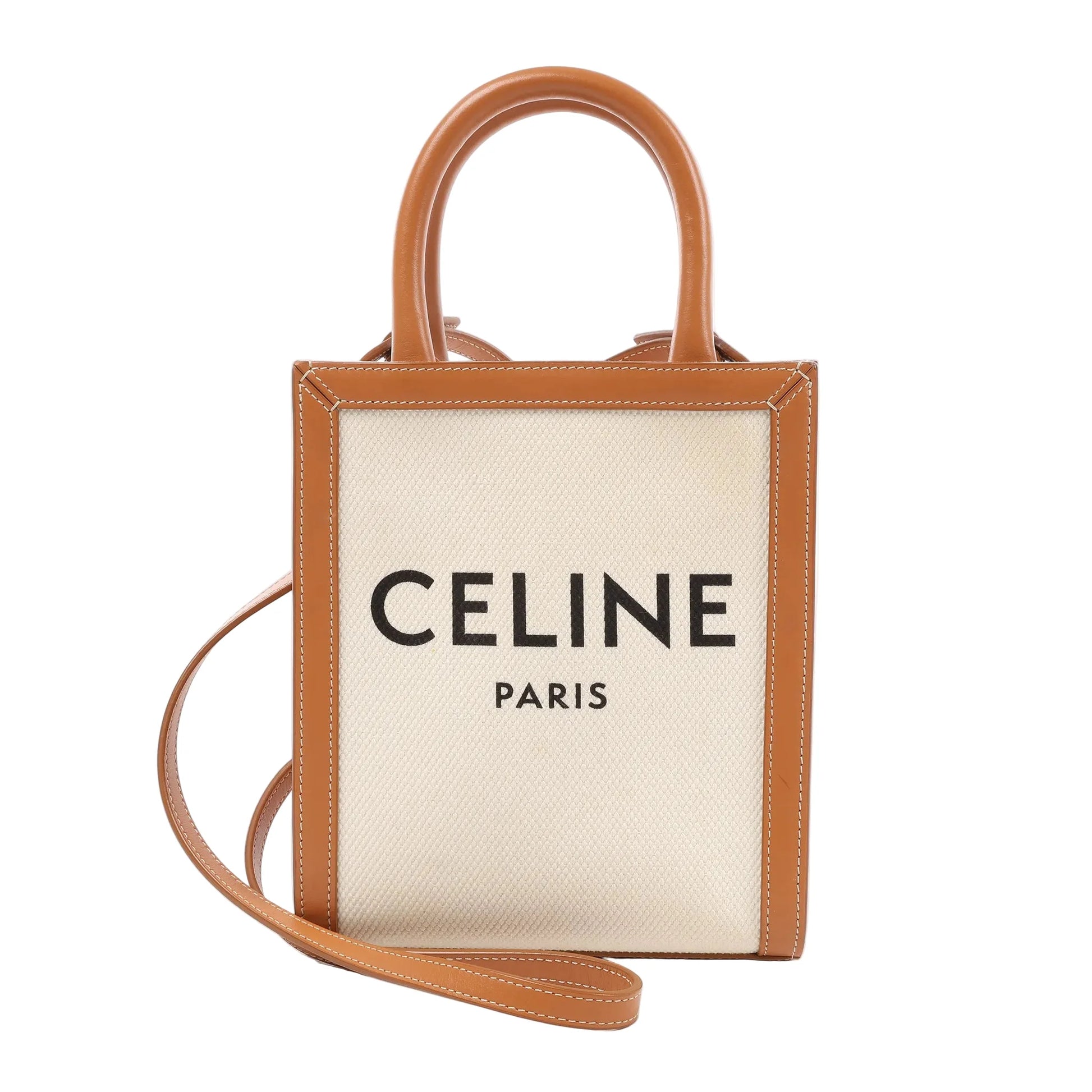 Front view of the Celine Vertical Mini 2Way Handbag featuring beige hippopotamus canvas with bold "CELINE PARIS" lettering, brown leather trim and handles, and a long matching leather shoulder strap, set against a white background.