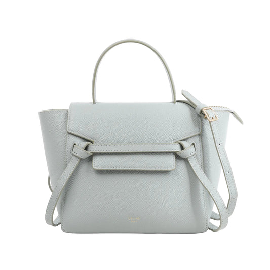 Celine Belt Bag Nano handbag in blue grained leather with belted flap front, top handle, detachable shoulder strap, and structured silhouette against a white background.
