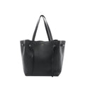 Black Celine Cabas Phantom Small leather shoulder tote with two long top handles, open-top silhouette, and front panel with knotted leather tie details, shown on a white background.