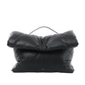 Black Celine Pillow leather handbag with a padded rectangular shape, oversized folded flap, slim top handle and small Celine Paris logo near the base.